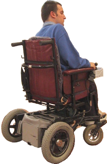 Photo showing the rear view of a man in a rear-wheel drive electric wheelchair